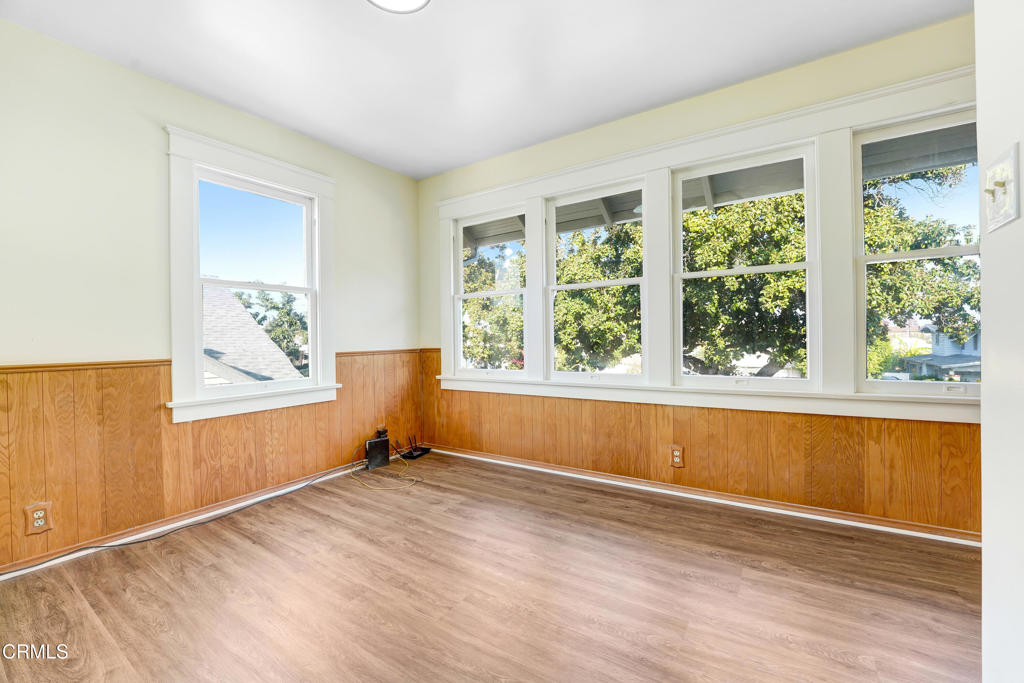907 North Stoneman Avenue Alhambra, CA 91801 - Photo 9 of 19 a view of a bedroom with wooden floor and a window
