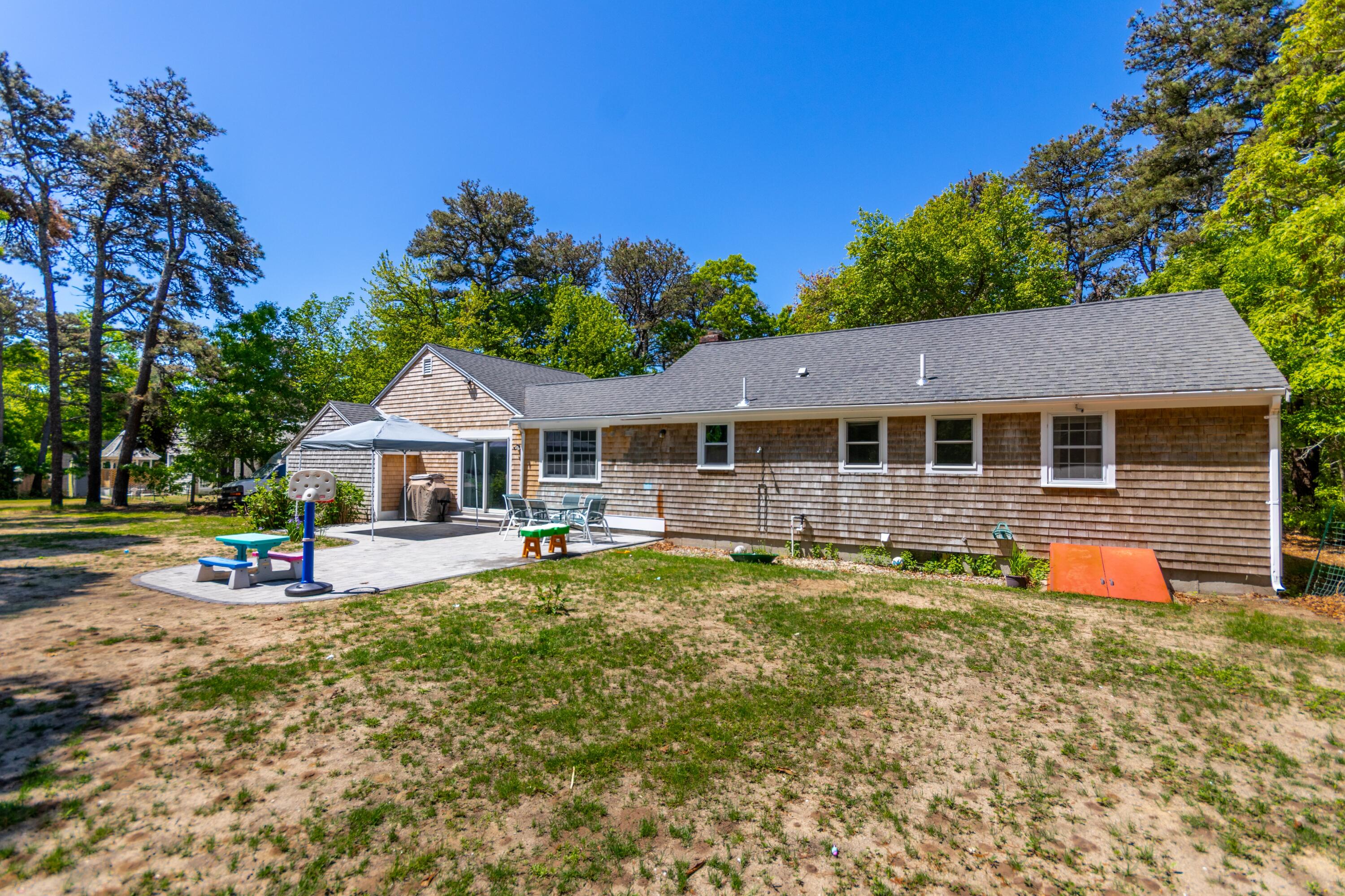490 Forest Road South Yarmouth, MA 02664 - Photo 3 of 30 Back angle with stone patio