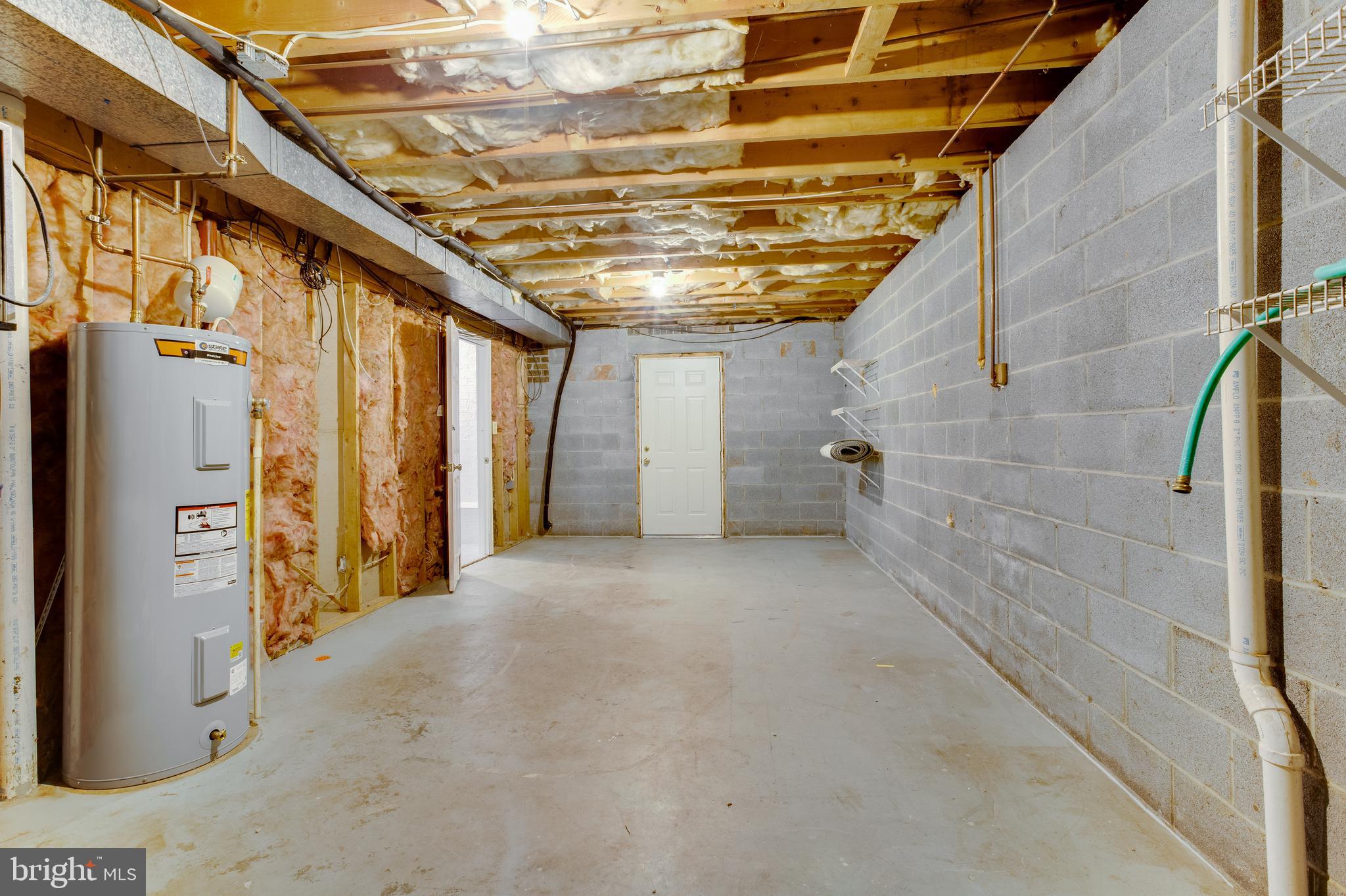 6727 Kelly Road Warrenton, VA 20187 - Photo 40 of 53 Basement storage area with walkout to back yard