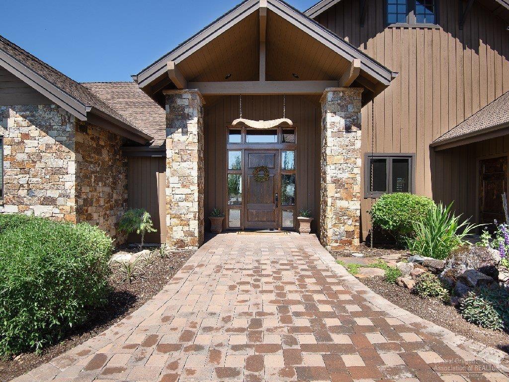 15784 South W Brasada Ranch Road Powell Butte, OR 97753 - Photo 4 of 23 Paver Entrance with Mature Landscaping a