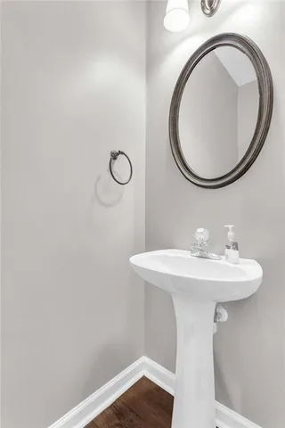 a bathroom with a sink a mirror and a toilet