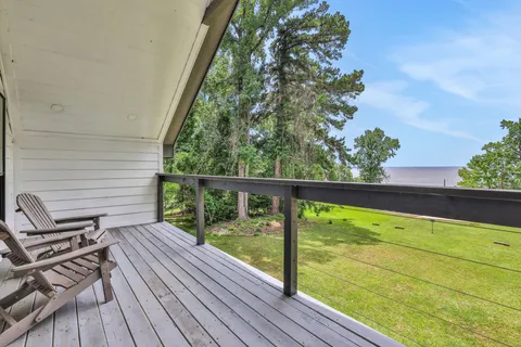 a view of a balcony with wooden floor