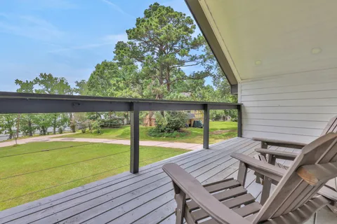 a view of a two chairs and table in the balcony