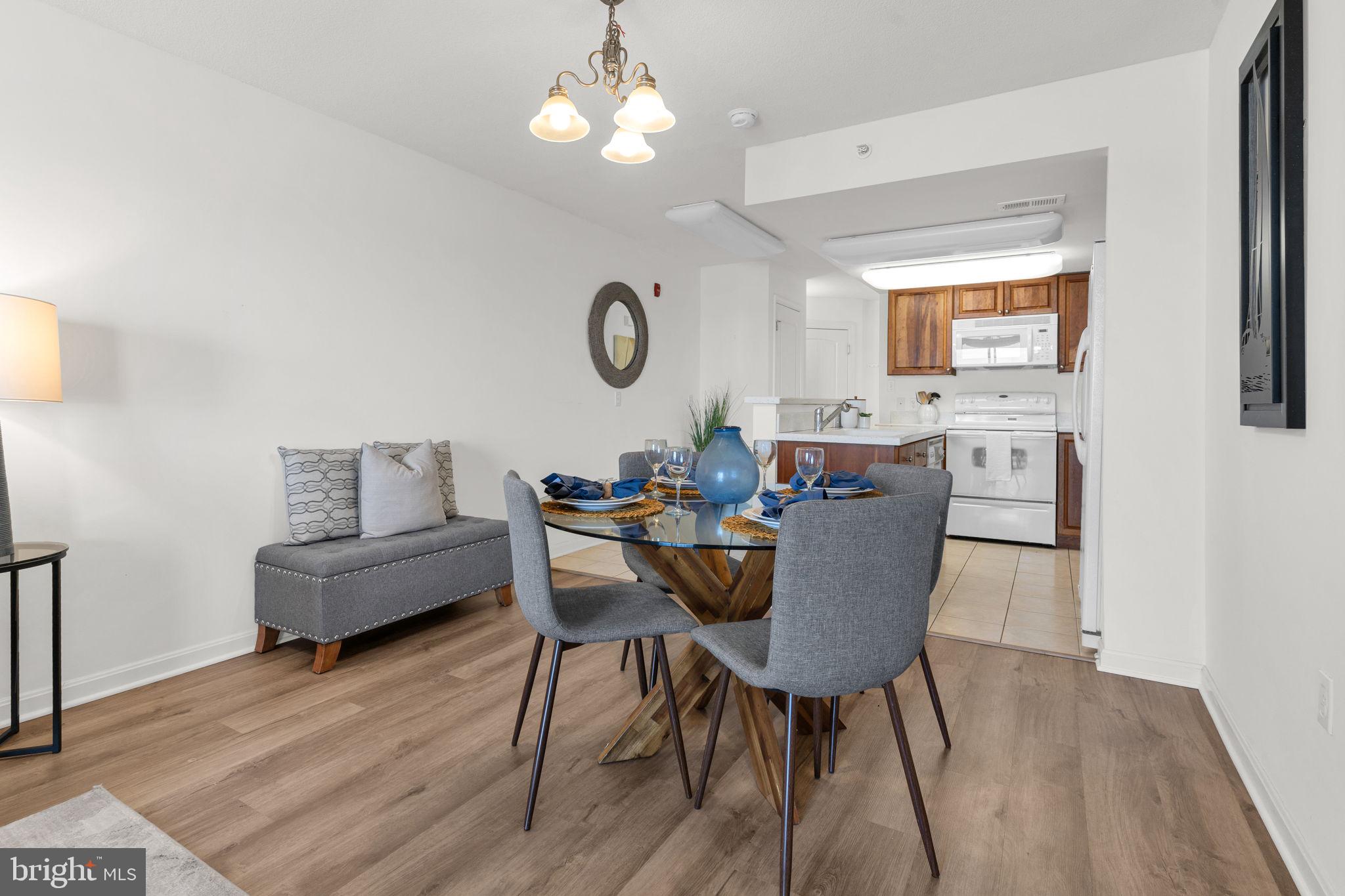 8501 Bayside Road, Unit 605 Chesapeake Beach, MD 20732 - Photo 14 of 30 Dining room with LVP flooring