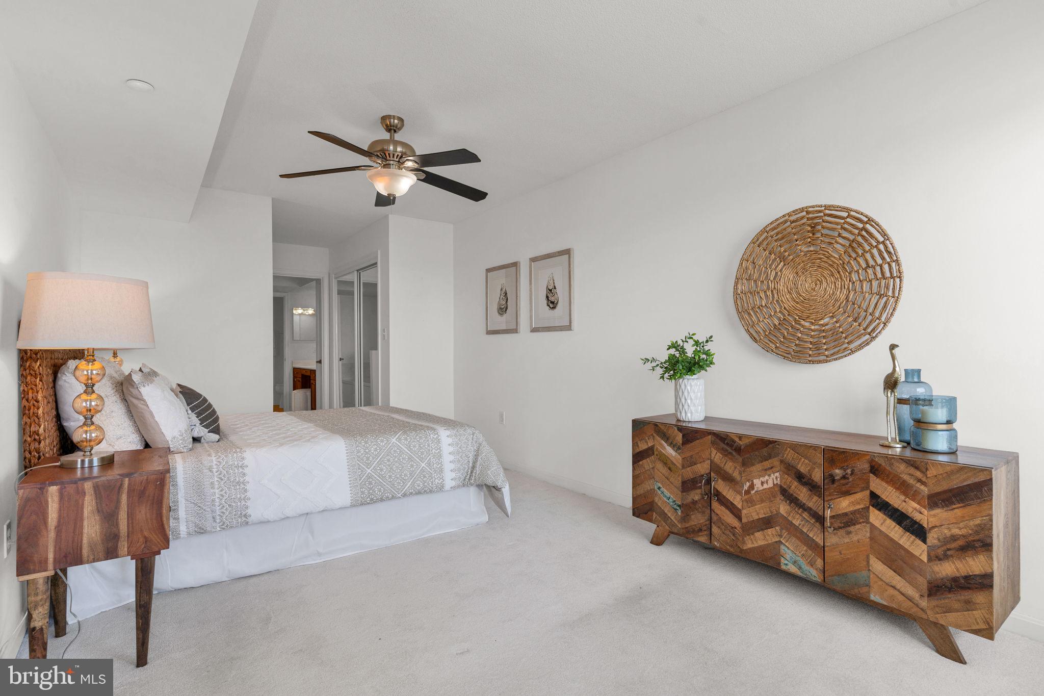 8501 Bayside Road, Unit 605 Chesapeake Beach, MD 20732 - Photo 17 of 30 Primary bedroom with wall to wall carpeting