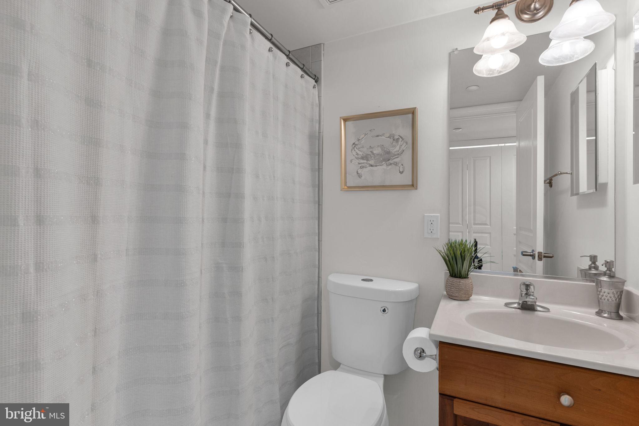 8501 Bayside Road, Unit 605 Chesapeake Beach, MD 20732 - Photo 26 of 30 Hall guest full bath with a tub