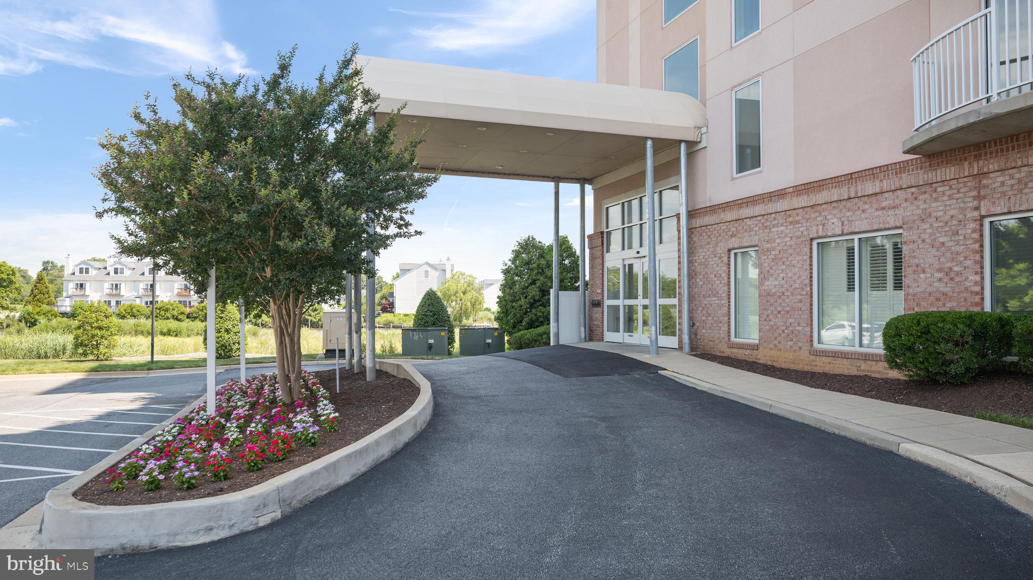 8501 Bayside Road, Unit 605 Chesapeake Beach, MD 20732 - Photo 4 of 30 a view of a porch with a couches in a patio