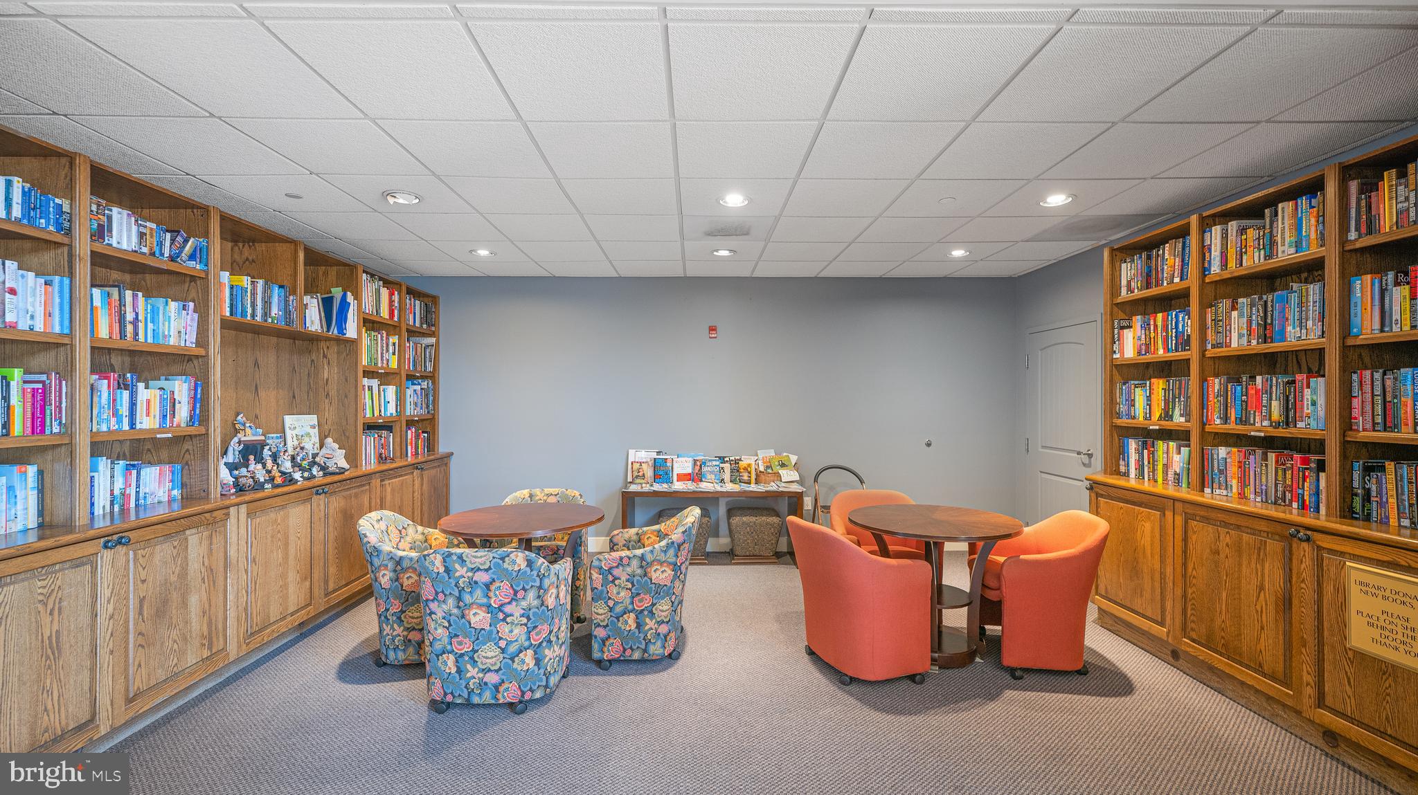 8501 Bayside Road, Unit 605 Chesapeake Beach, MD 20732 - Photo 7 of 30 a room with furniture and book shelf