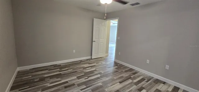 a view of room with wooden floor