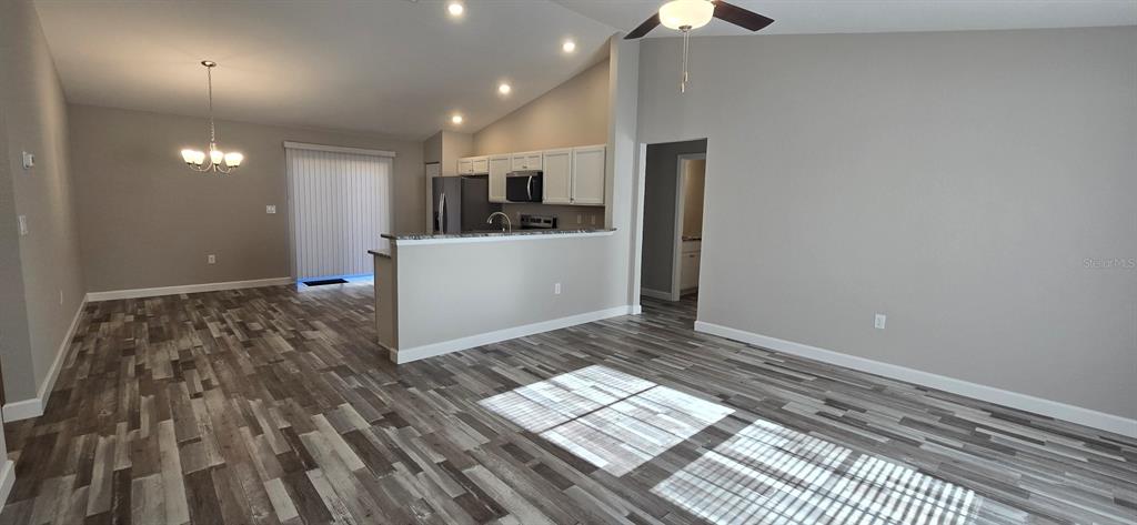 22 Pine Course Loop Ocala, FL 34472 - Photo 2 of 17 a view of kitchen and utility room with wooden floor