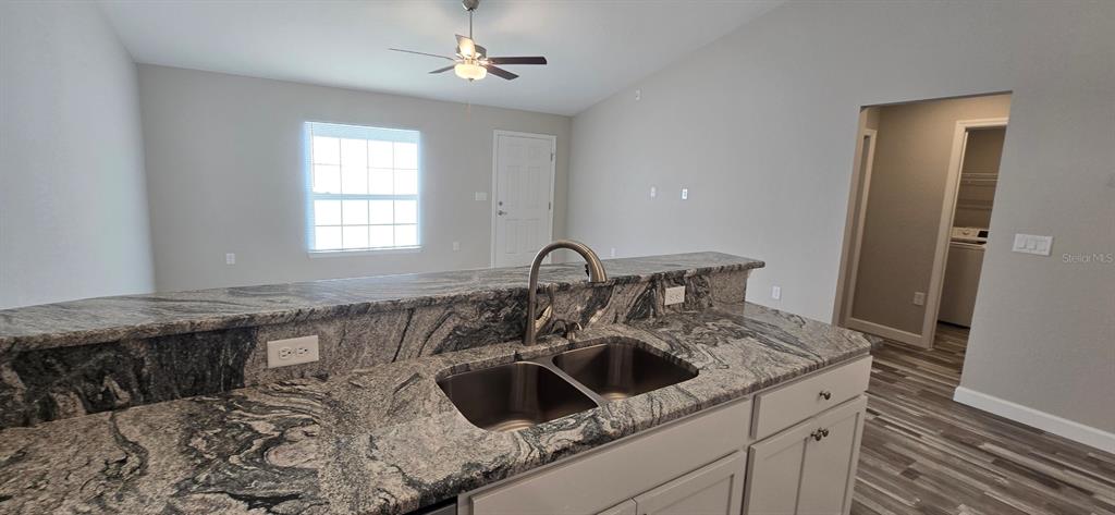 22 Pine Course Loop Ocala, FL 34472 - Photo 6 of 17 a kitchen with a sink and a stove top oven
