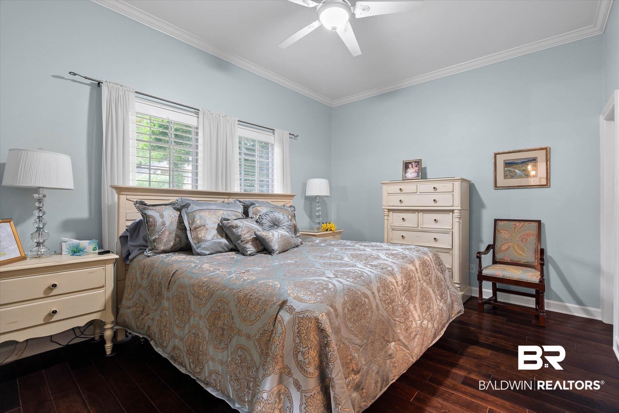 136 Old Mill Road Fairhope, AL 36532 - Photo 19 of 36 Hardwood flooring throughout featuring white crown molding and baseboards