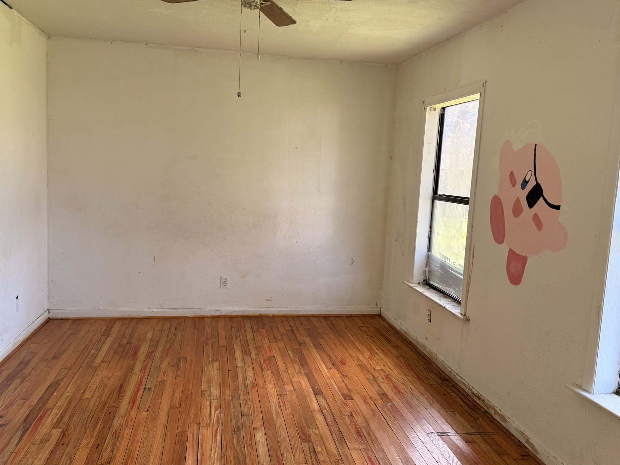 3122 Hamilton Street La Porte, TX 77571 - Photo 11 of 20 a view of empty room with wooden floor and fan