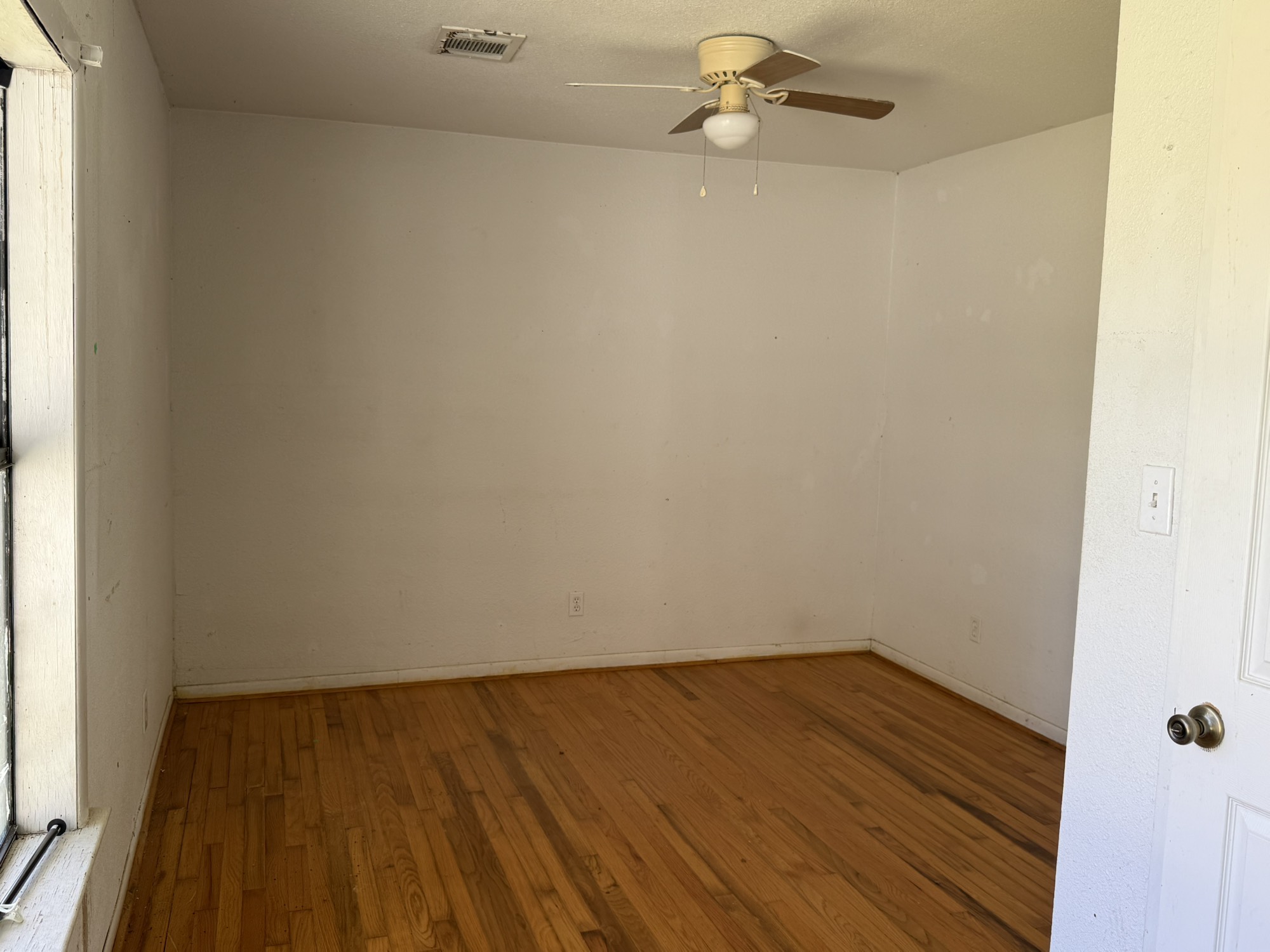 3122 Hamilton Street La Porte, TX 77571 - Photo 12 of 20 a view of a room with wooden floor and a window