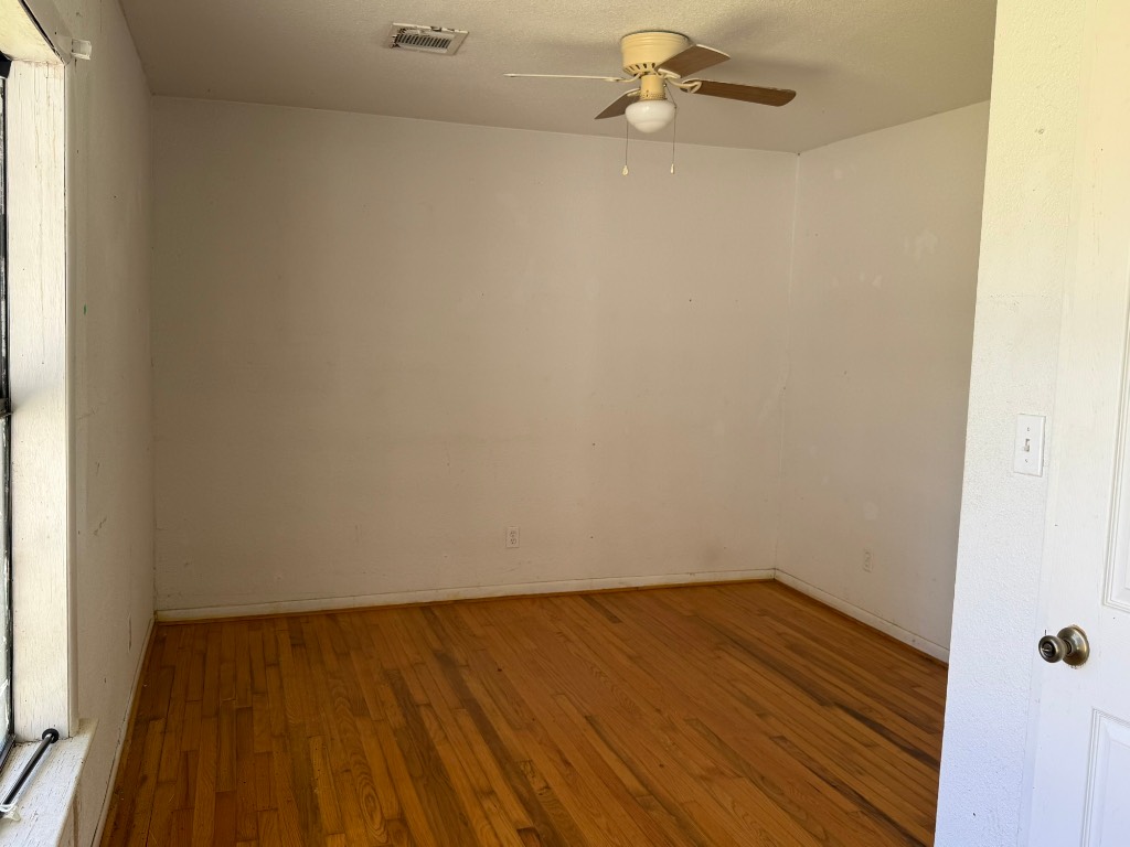 3122 Hamilton Street La Porte, TX 77571 - Photo 12 of 20 a view of a room with wooden floor and a window