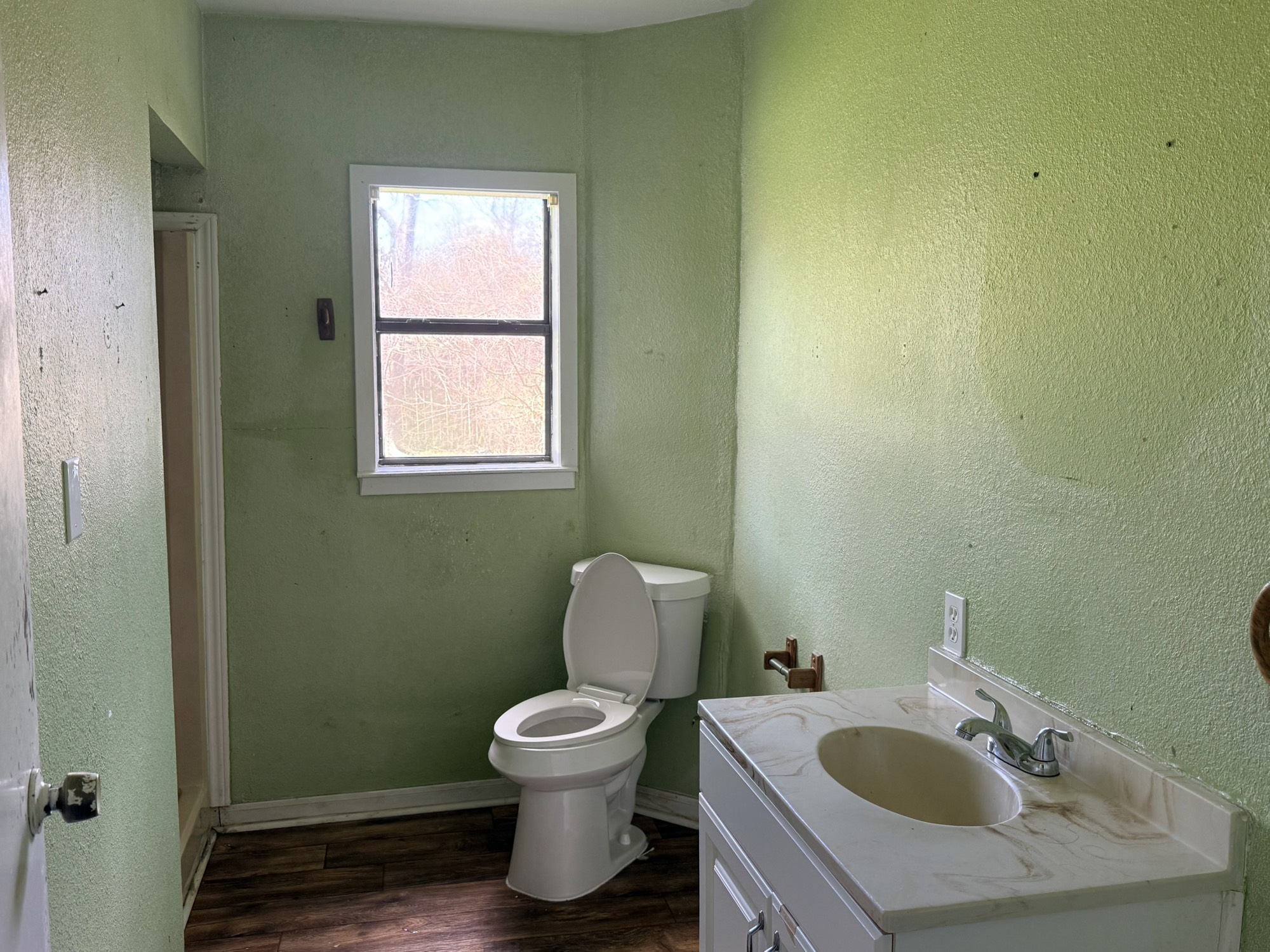 3122 Hamilton Street La Porte, TX 77571 - Photo 15 of 20 a white toilet sitting next to a bathroom sink
