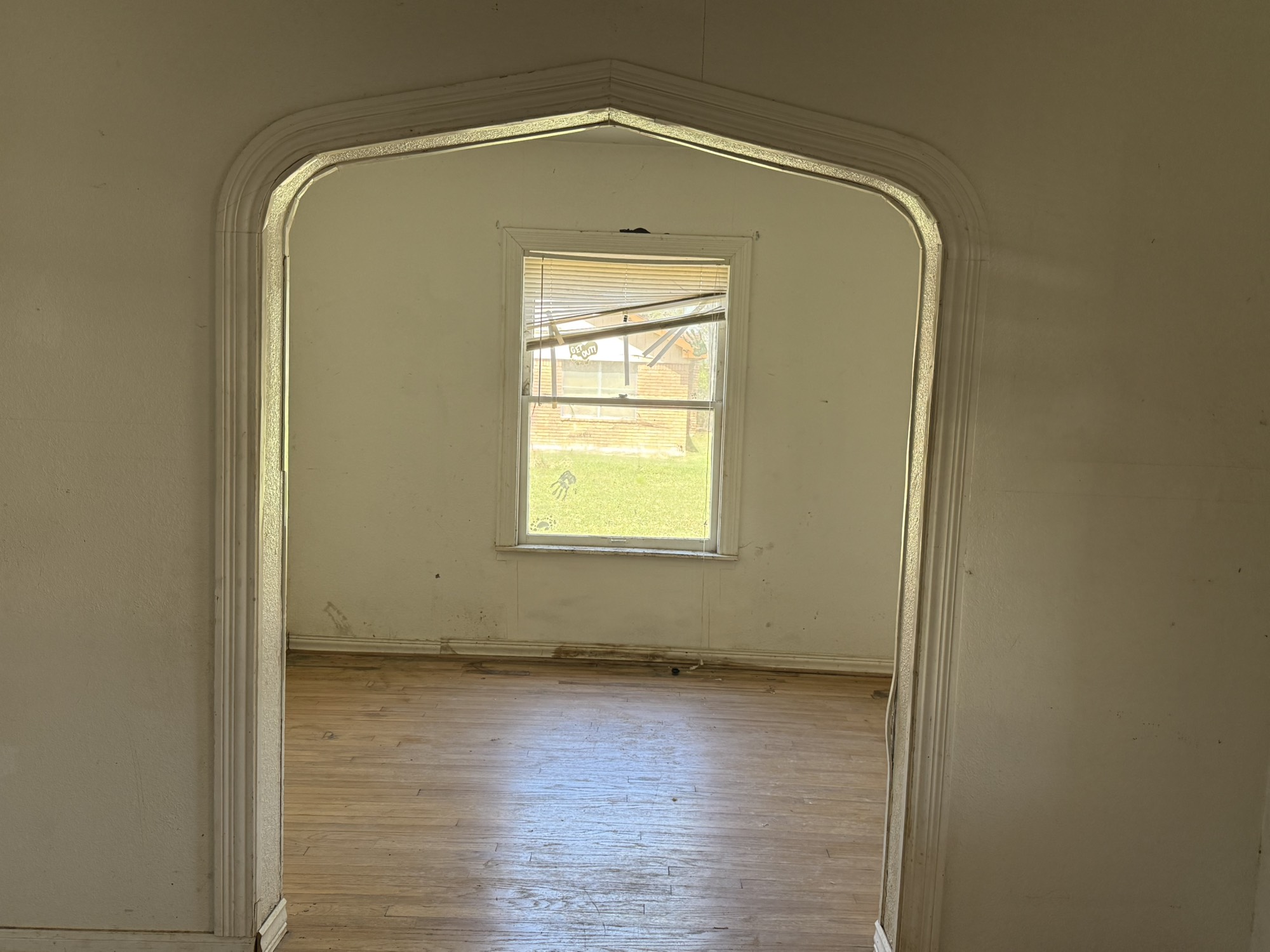 3122 Hamilton Street La Porte, TX 77571 - Photo 8 of 20 an empty room with wooden floor and windows