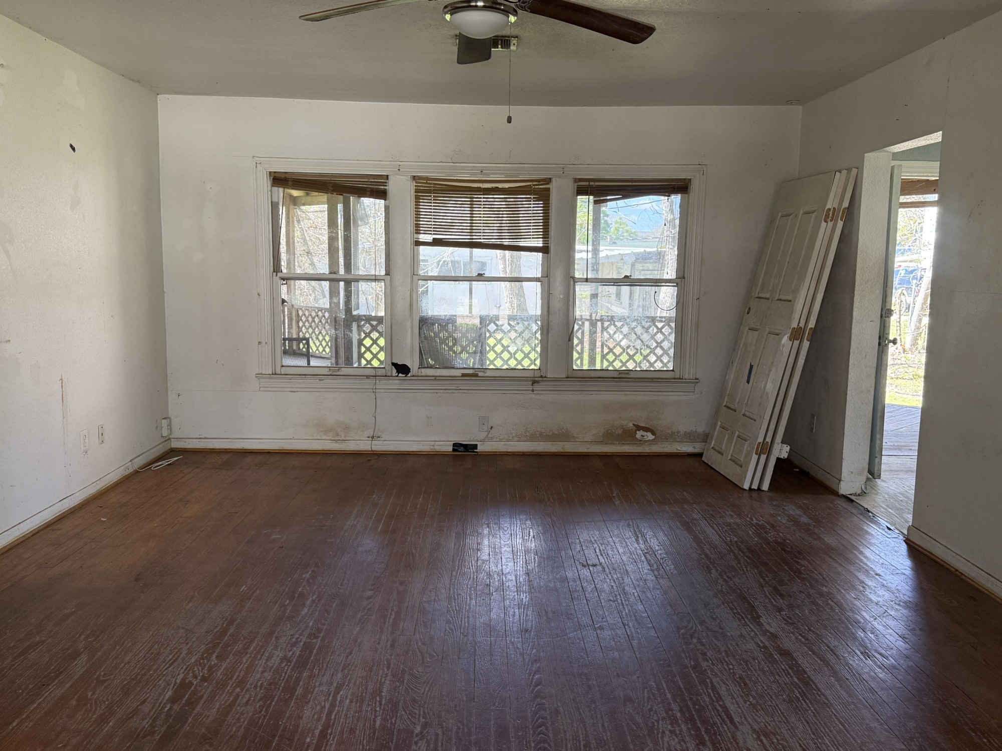 3122 Hamilton Street La Porte, TX 77571 - Photo 9 of 20 an empty room with wooden floor and windows