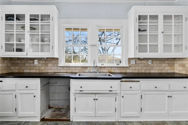 a kitchen with stainless steel appliances granite countertop a stove and a sink