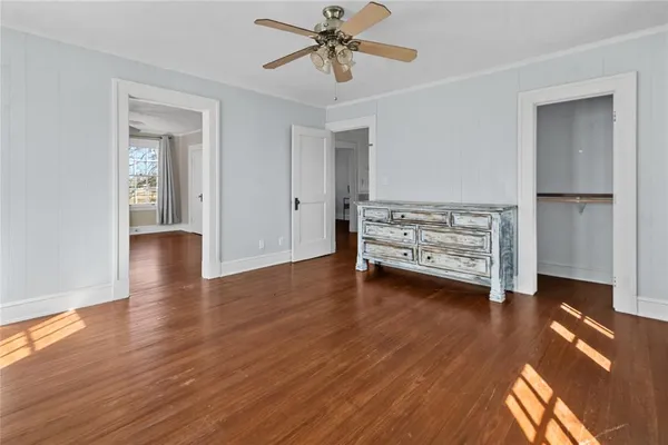 a view of livingroom with hardwood floor and ceiling fan