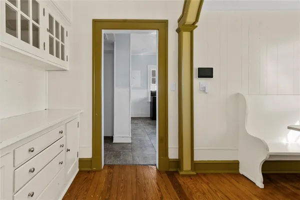 a view of hallway with wooden floor