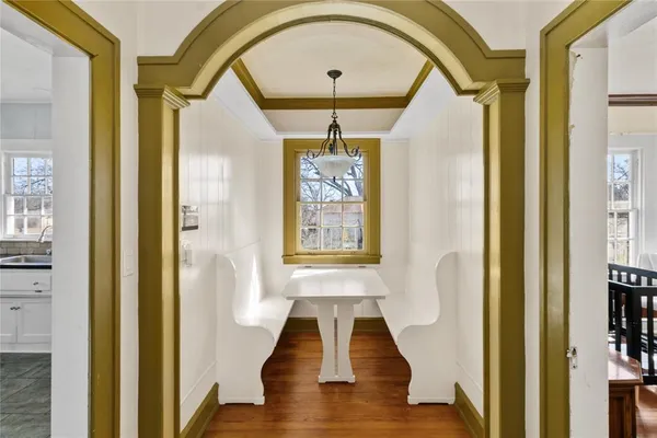 a view of entryway with wooden floor