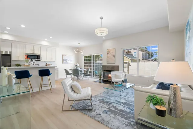 a living room with furniture a table and chairs