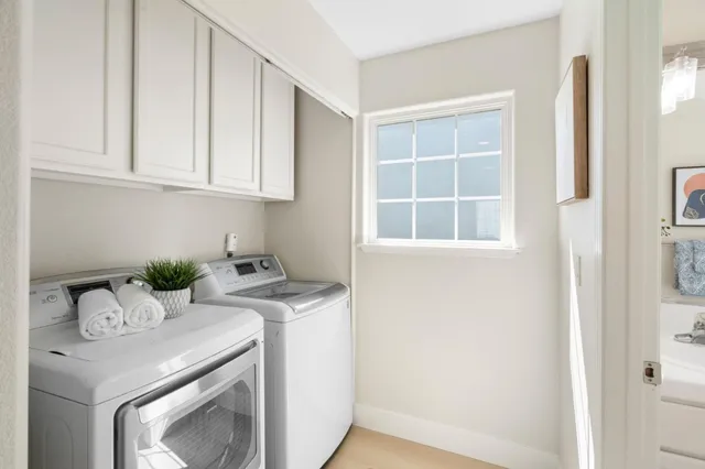 a view of storage and utility room with washer and dryer
