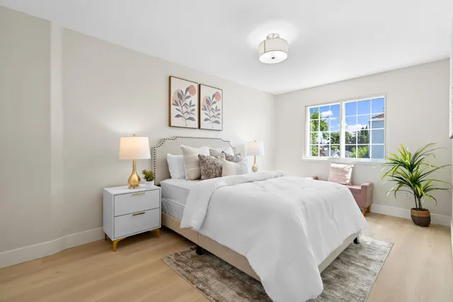 a bedroom with bed and a window