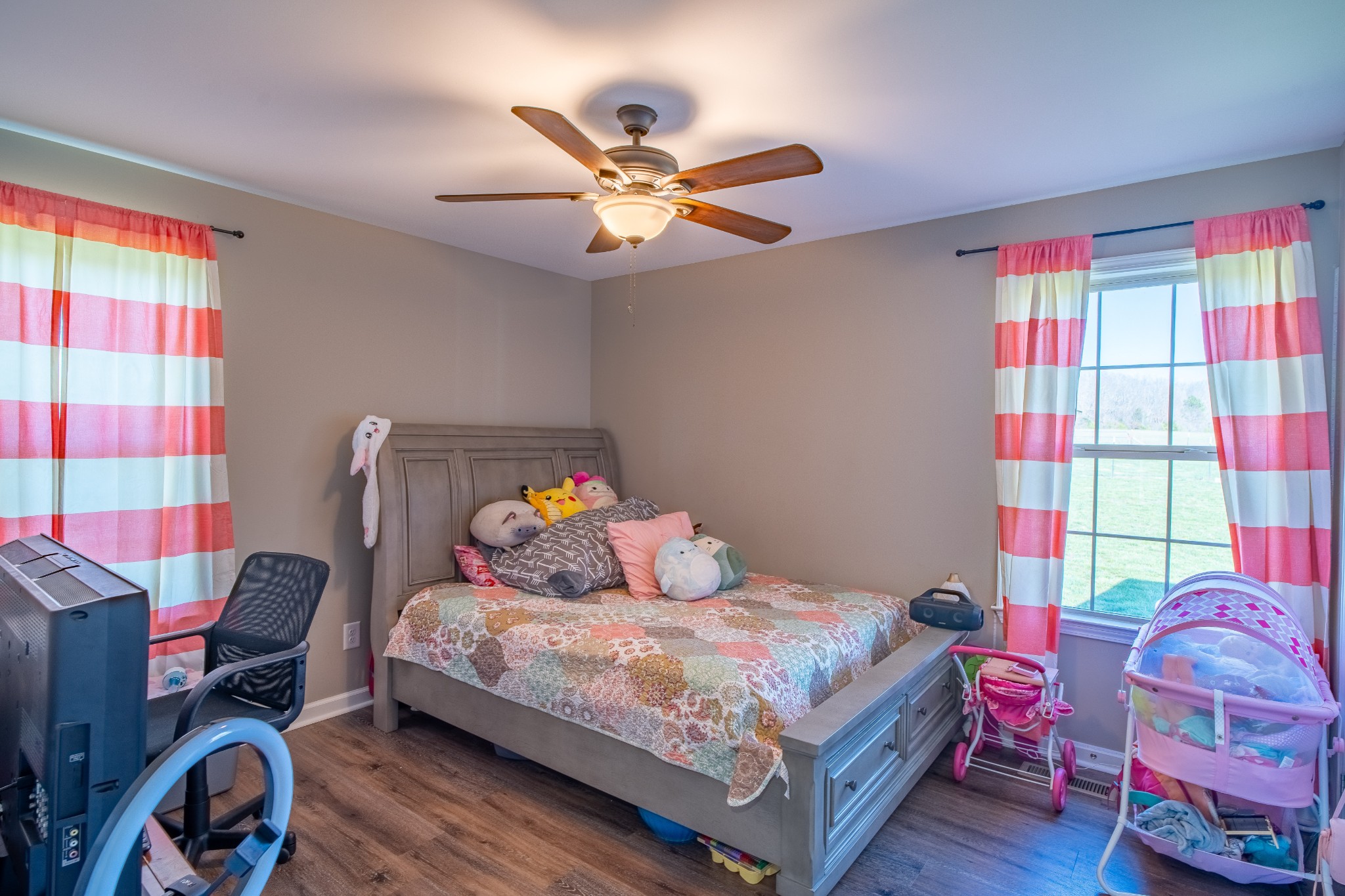 83 Waterloo Road Lawrenceburg, TN 38464 - Photo 27 of 34 a bedroom with a bed and wooden floor
