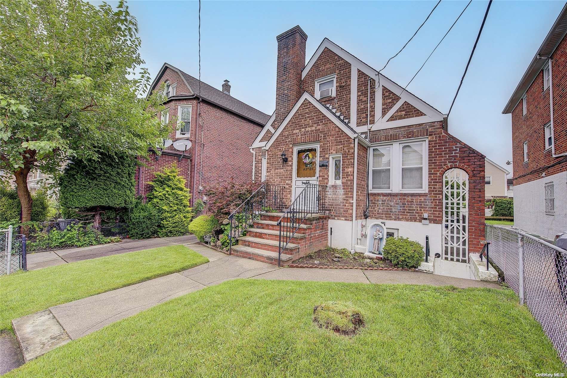Front of home with stairs in Front to access legal basement Apt