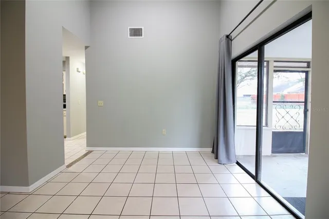 a view of an empty room and window in a room