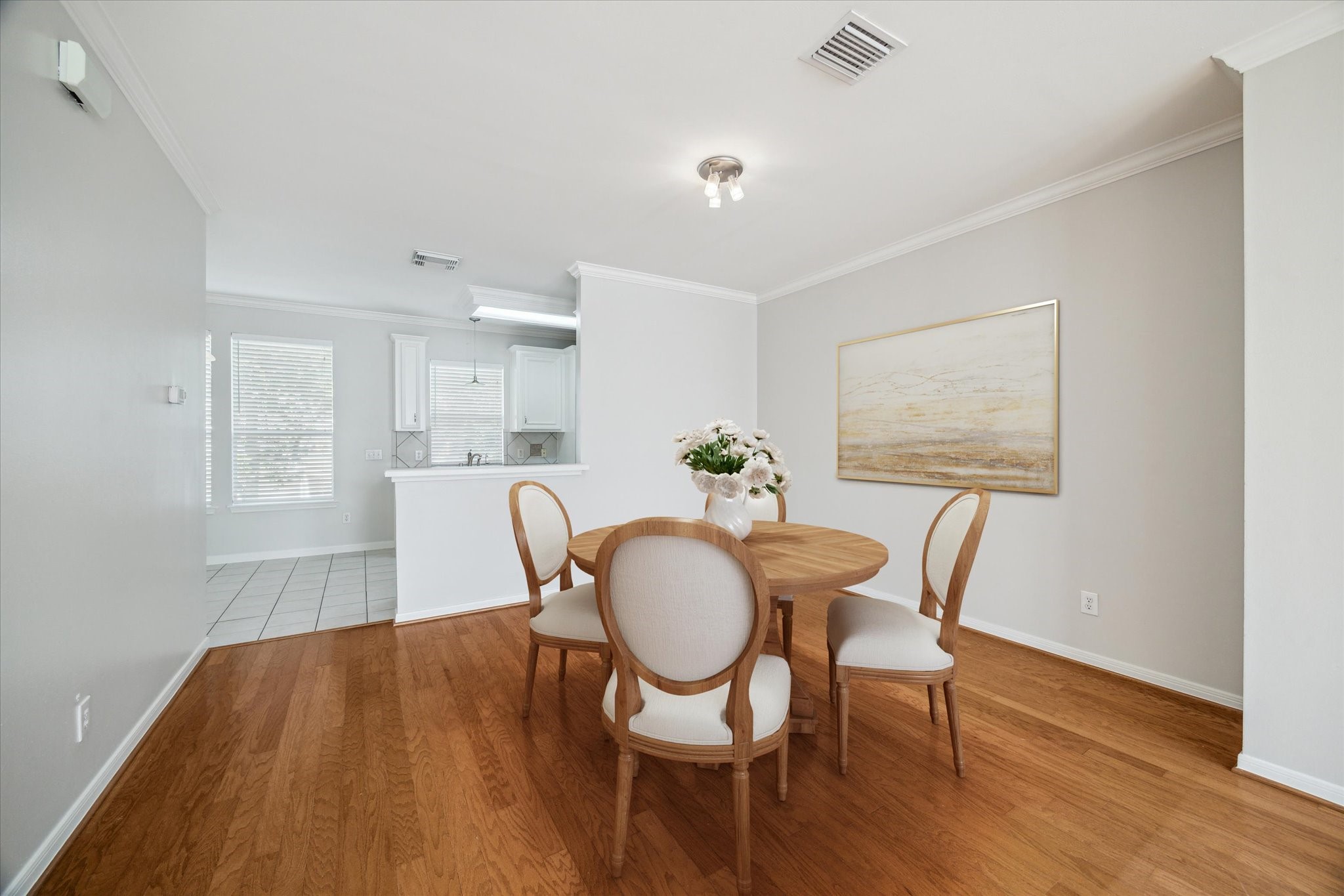1639 Sutton Street Houston, TX 77006 - Photo 12 of 27 a view of a dining room with furniture and wooden floor