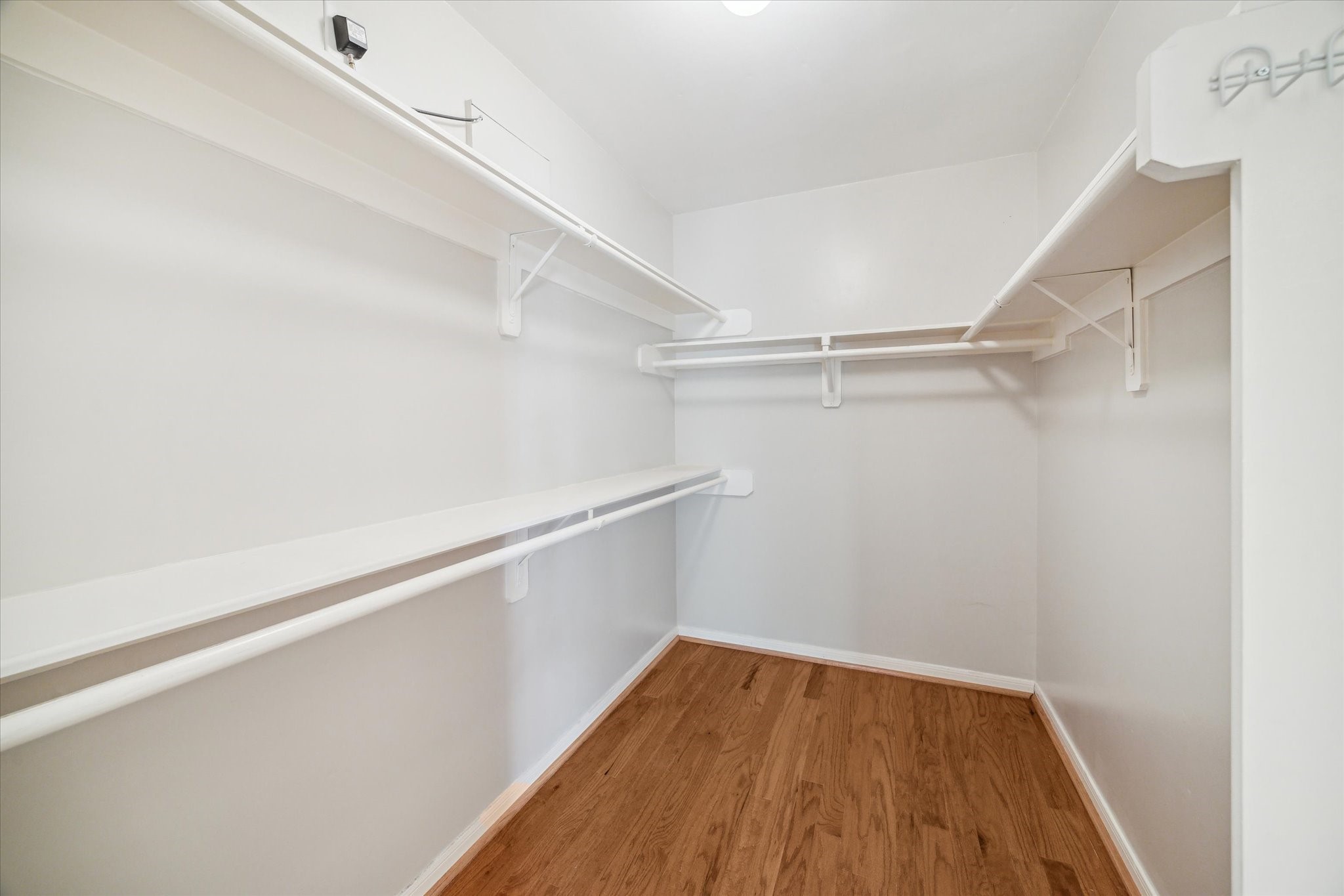 1639 Sutton Street Houston, TX 77006 - Photo 20 of 27 a view of a room with wooden floor