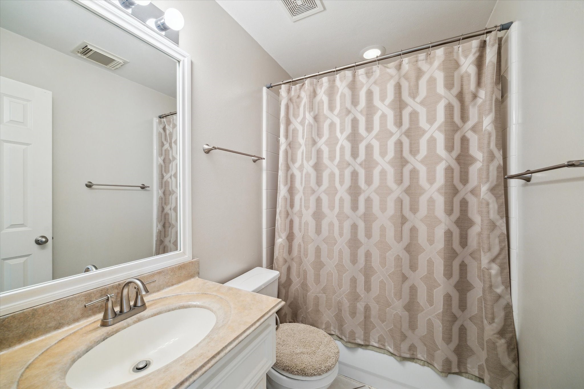 1639 Sutton Street Houston, TX 77006 - Photo 6 of 27 a bathroom with a granite countertop sink and a mirror