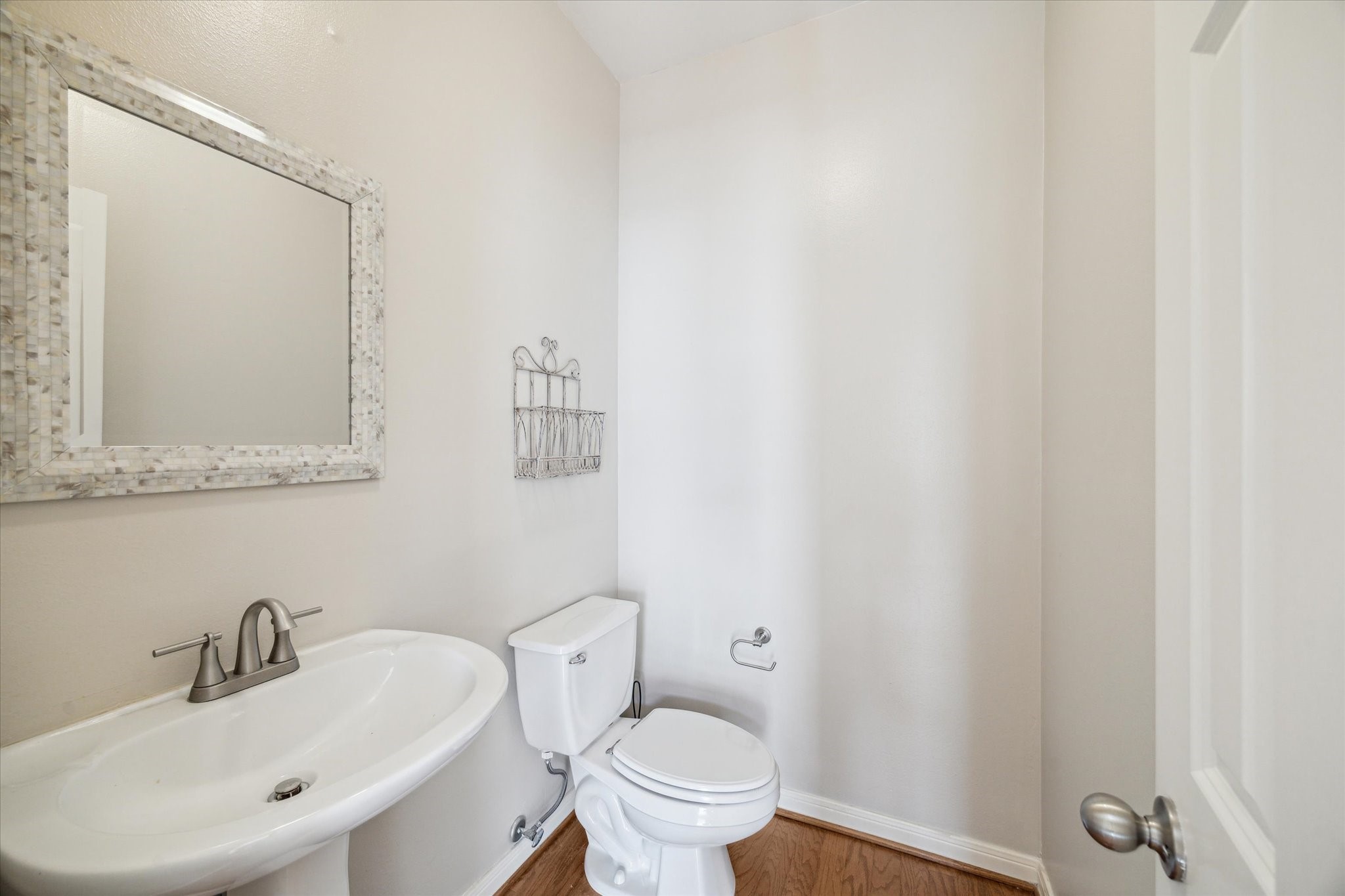 1639 Sutton Street Houston, TX 77006 - Photo 10 of 27 a bathroom with a sink and a toilet