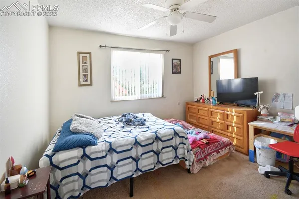 a bedroom with furniture and windows