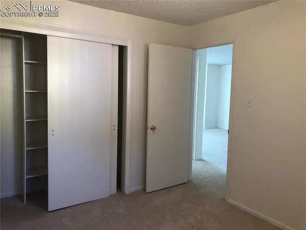 a kitchen with a stove and a refrigerator