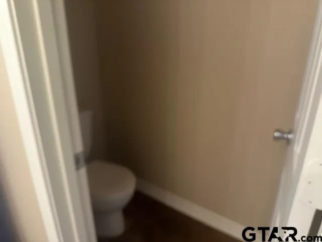 a white toilet and sink