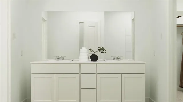 a bathroom with a sink and vanity