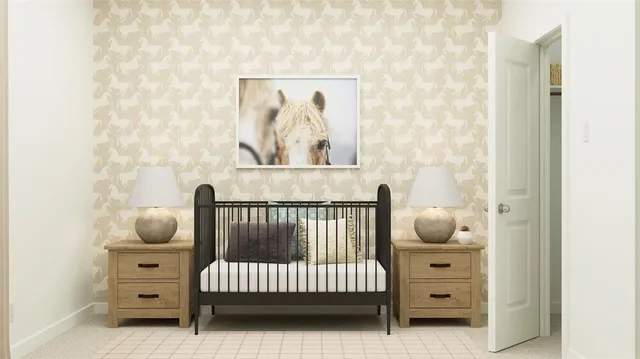 a bedroom with a baby bed a couch and chair