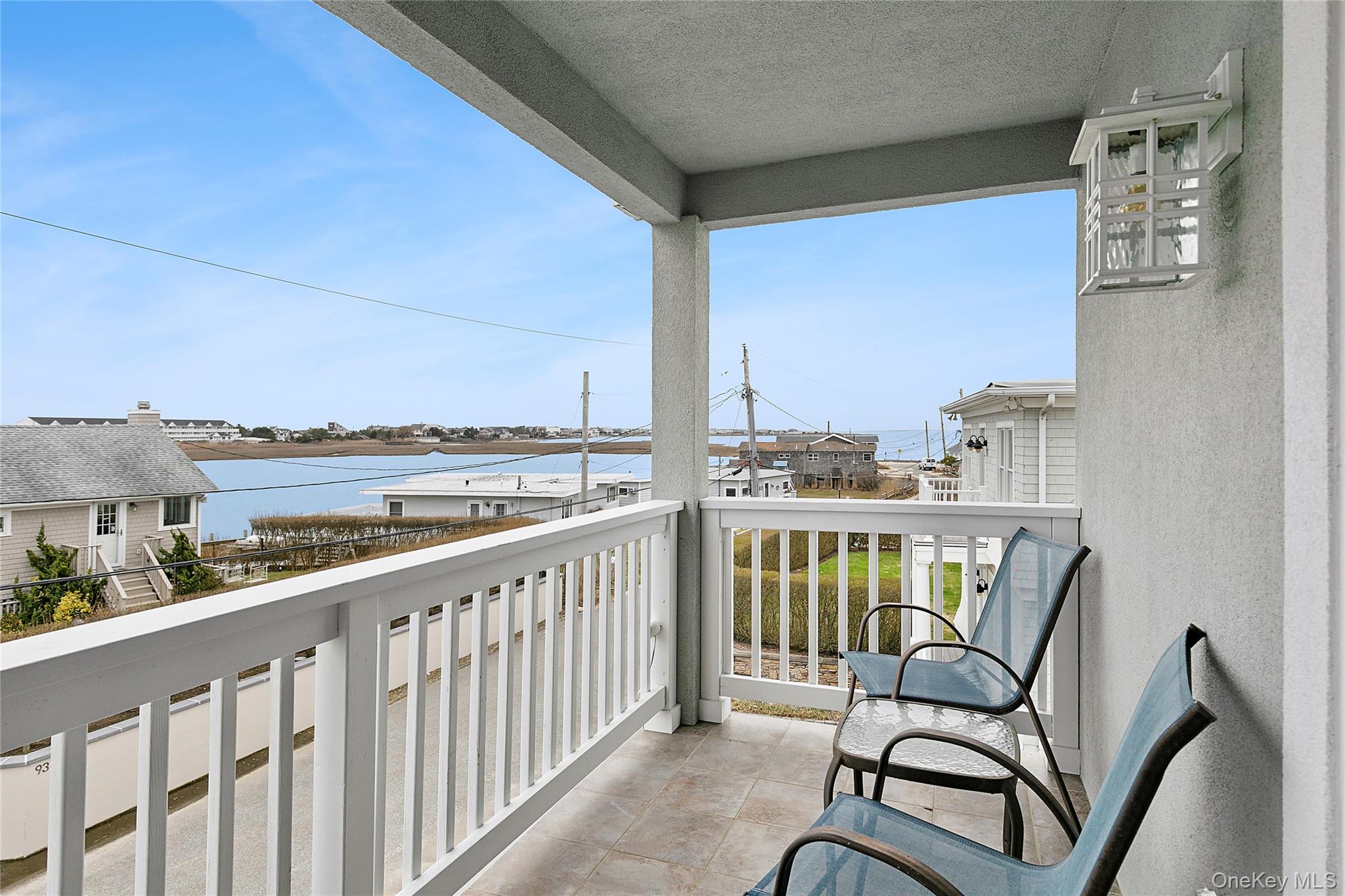 88 Point Road Westhampton Beach, NY 11978 - Photo 12 of 16 a view of a balcony with chairs