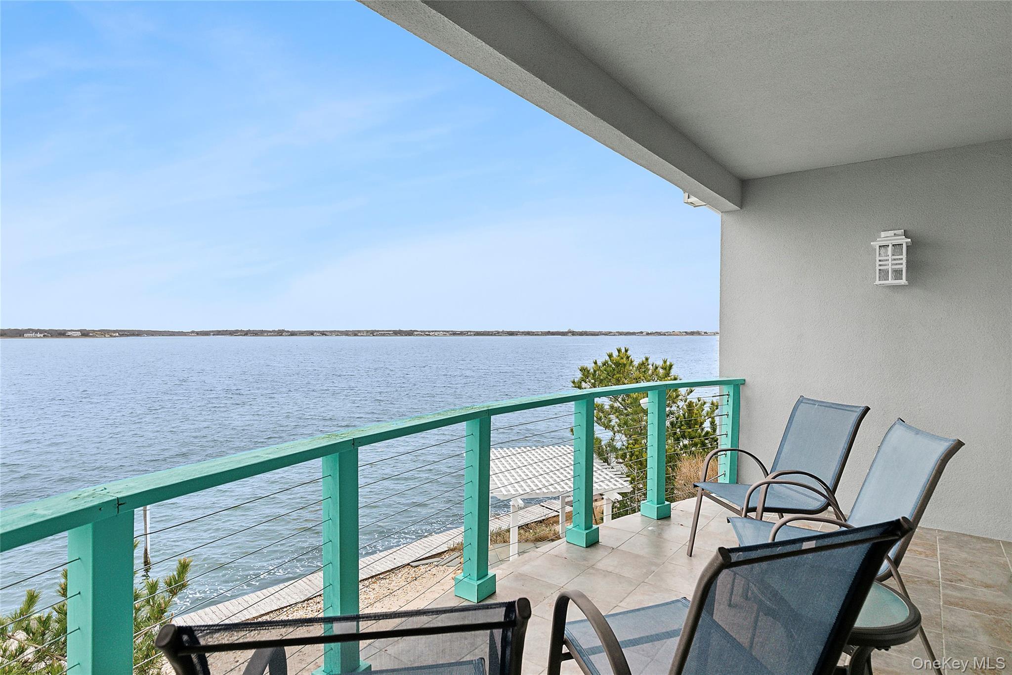 88 Point Road Westhampton Beach, NY 11978 - Photo 13 of 16 a view of a chairs and table in the balcony
