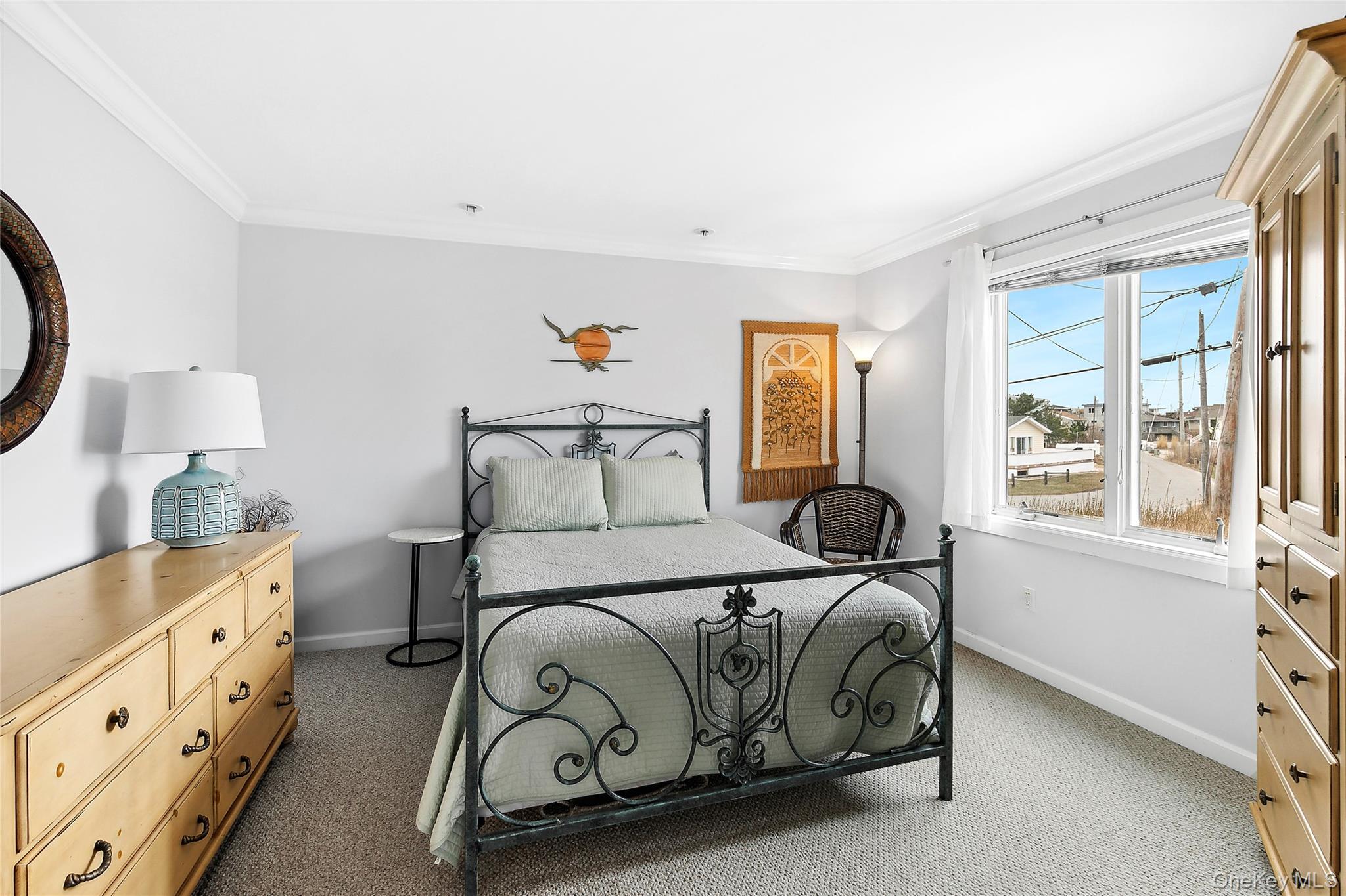 88 Point Road Westhampton Beach, NY 11978 - Photo 7 of 16 a bedroom with a bed and window