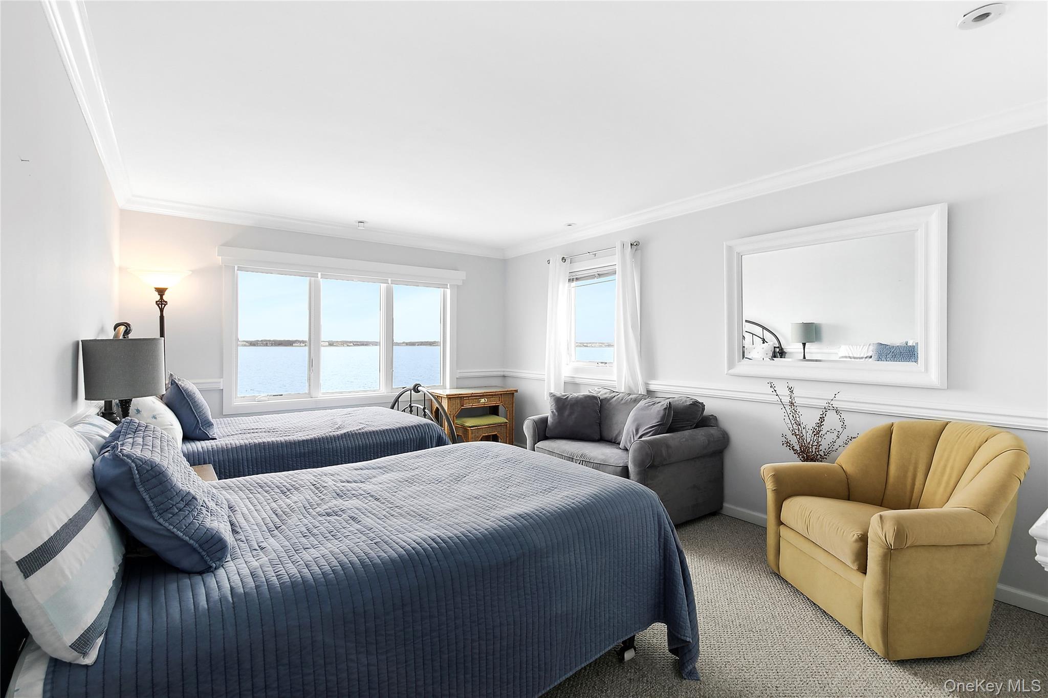 88 Point Road Westhampton Beach, NY 11978 - Photo 8 of 16 a bedroom with two beds and a couch
