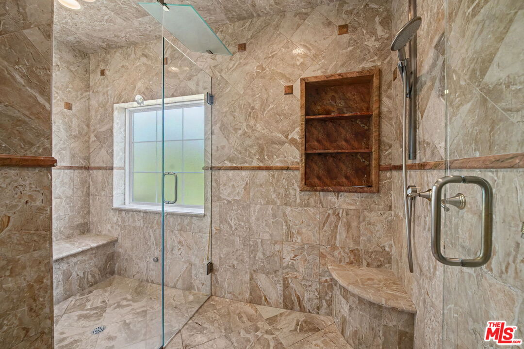 204 Foothill Road Beverly Hills, CA 90210 - Photo 29 of 38 a bathroom with a shower