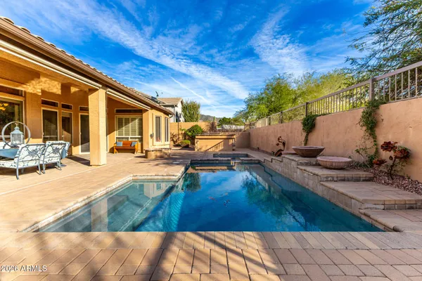 a view of a swimming pool with a patio