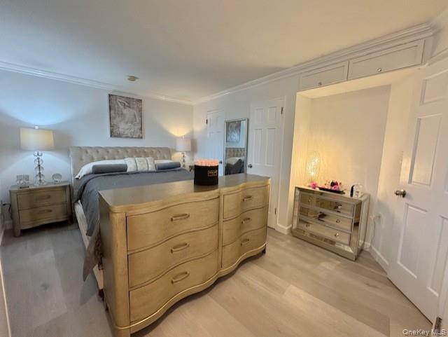 830 Shore Road, Unit 1F Long Beach, NY 11561 - Photo 12 of 21 a bedroom with a bed and a dresser