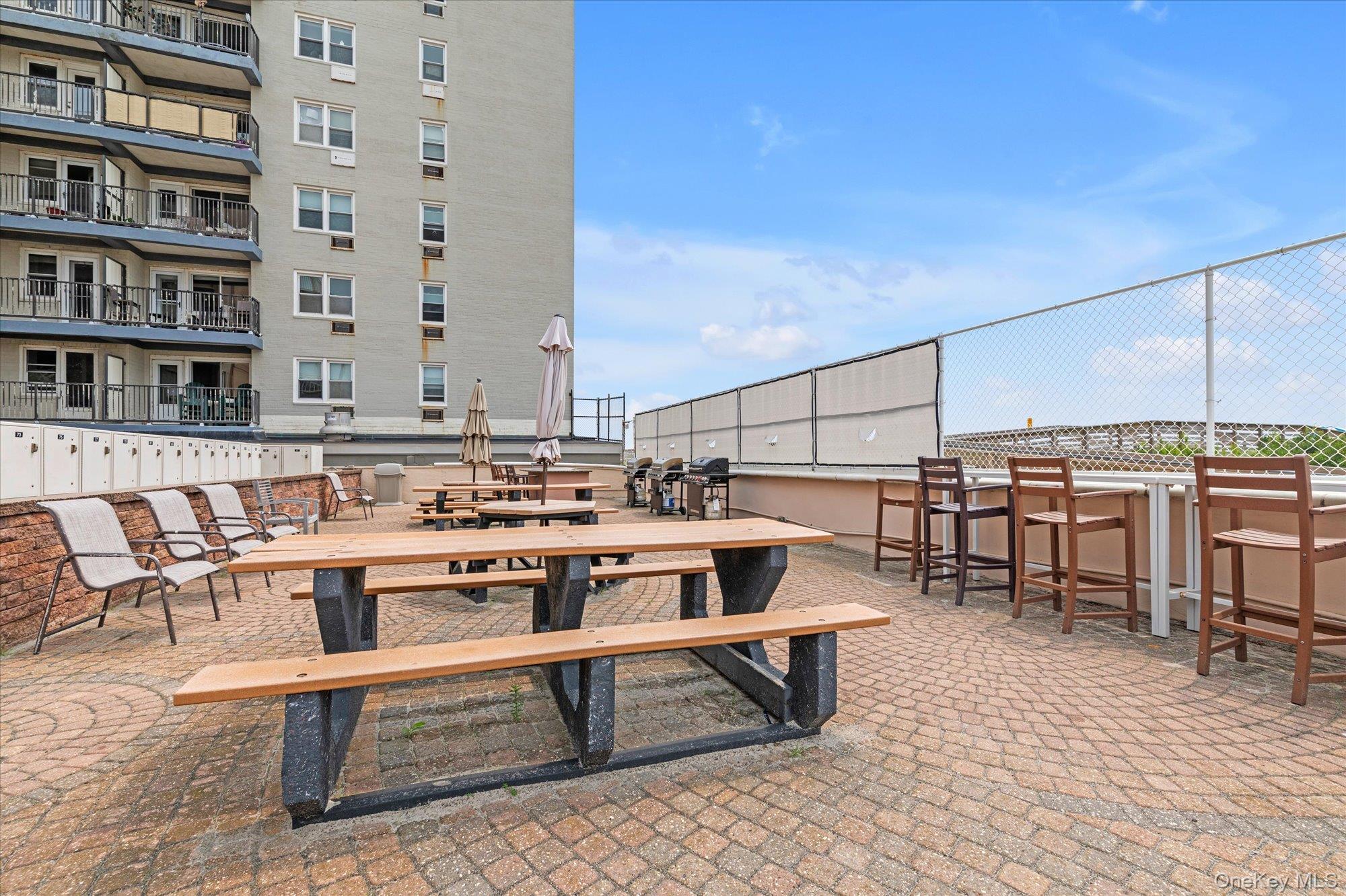 830 Shore Road, Unit 1F Long Beach, NY 11561 - Photo 16 of 21 a view of a chairs and table in a terrace