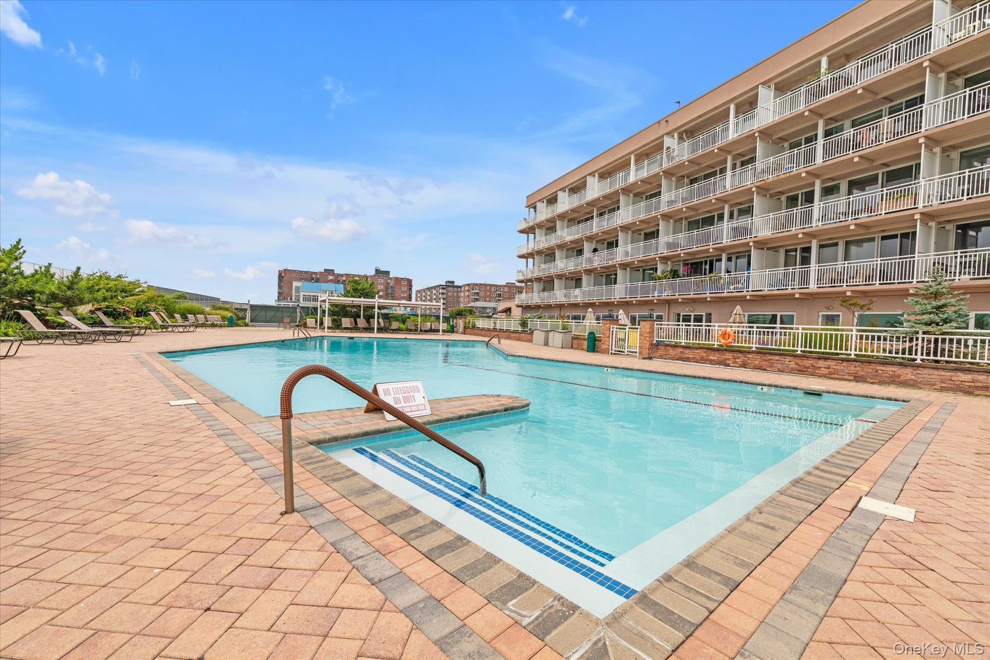 830 Shore Road, Unit 1F Long Beach, NY 11561 - Photo 2 of 21 a view of swimming pool with chairs